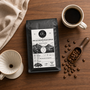 Flat lay of Decaf Honduras Copan coffee bag with brewing equipment and beans