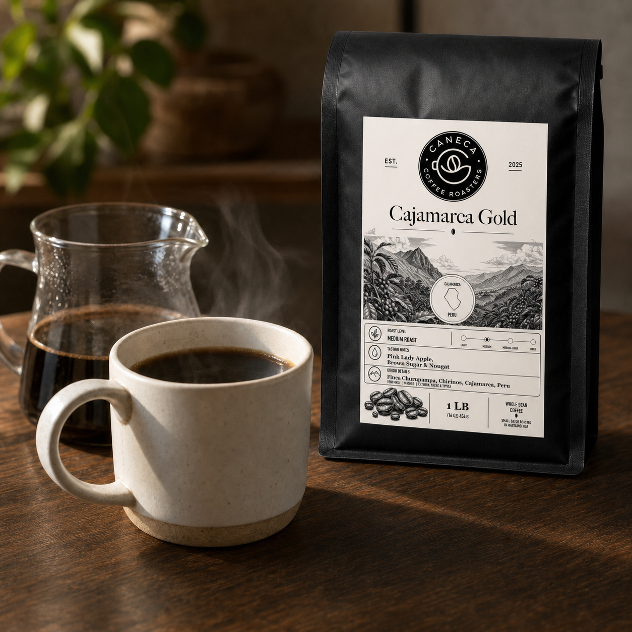 Cajamarca Gold coffee bag with steaming brewed coffee and glass server