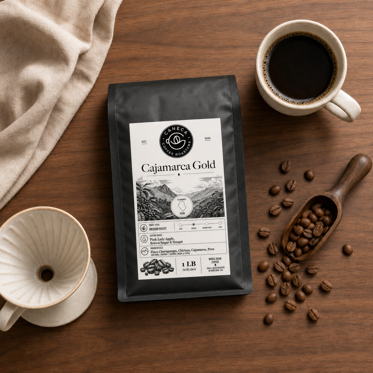 Flat lay of Cajamarca Gold coffee bag with brewing equipment and beans