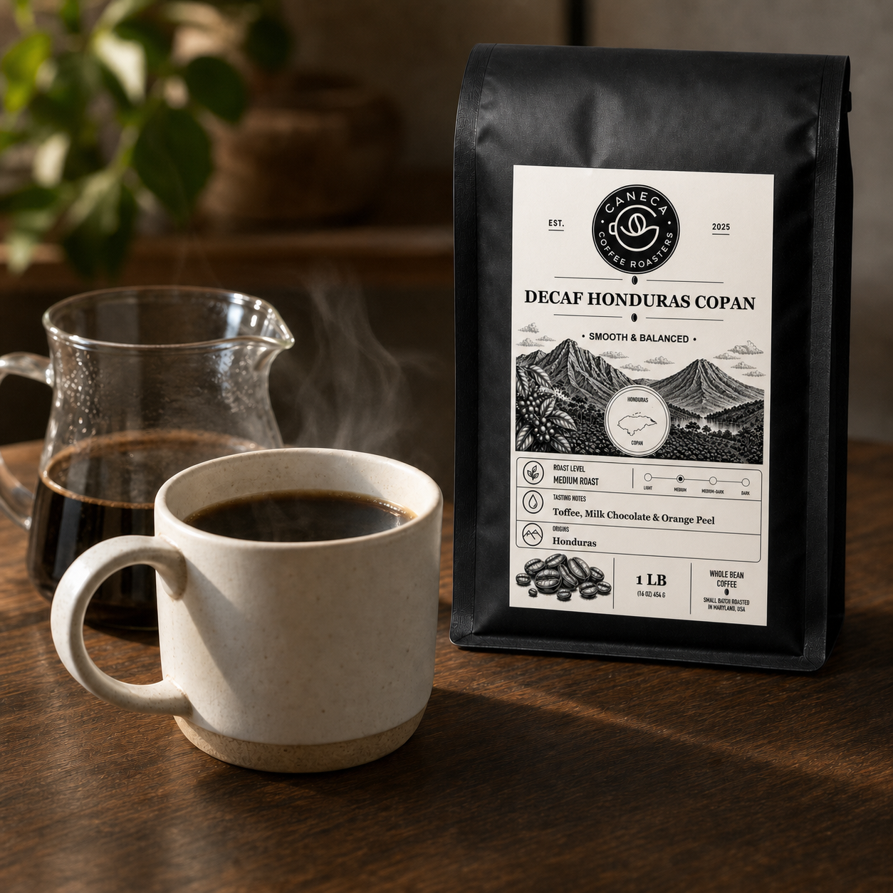 Decaf Honduras Copan coffee bag with steaming brewed coffee and glass server