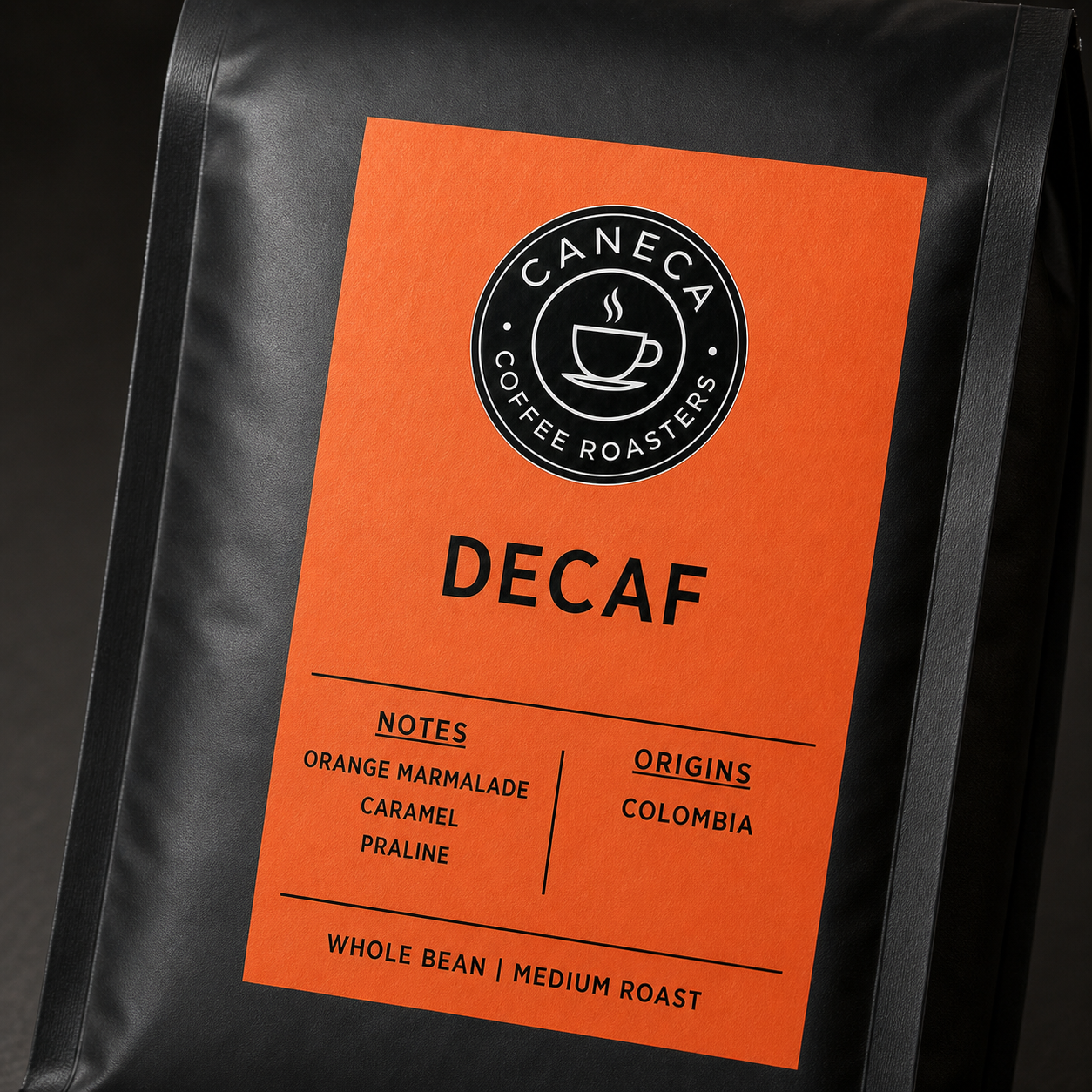 Close-up of the CANECA DECAF medium roast label and matte coffee bag