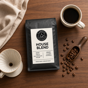 Overhead flat lay of CANECA House Blend medium roast coffee and brewing tools