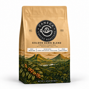 CANECA Golden Dawn Blend medium-dark roast coffee bag with new champagne-gold landscape packaging